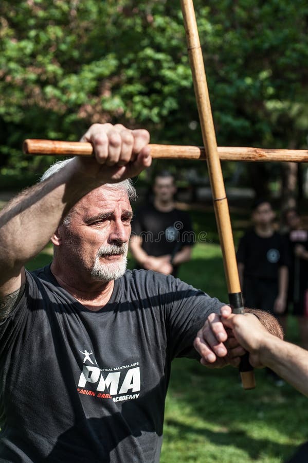 Filipino Martial Arts Instructor Demonstrates Stick Fighting Techniques  Stock Photo - Image of astig, outdoor: 109278684