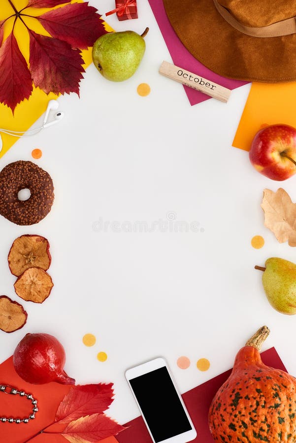 Hat, smartphone, fruits, pumpkin, dry leaves, multicolored papers, donut, coffee grains, wooden block with november inscription isolated on white,stock image. Hat, smartphone, fruits, pumpkin, dry leaves, multicolored papers, donut, coffee grains, wooden block with november inscription isolated on white,stock image