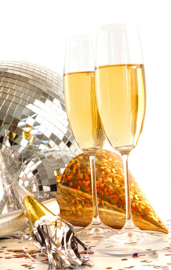 Champagne glass with gold party hats and disco ball. Champagne glass with gold party hats and disco ball