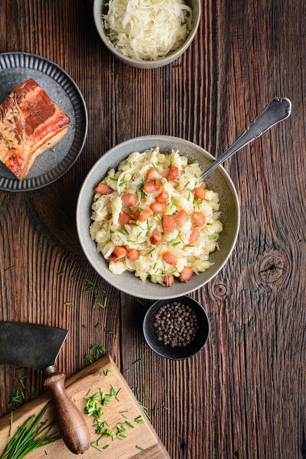 Kapustove halusky known as Strapacky, classic dish in Slovakia, boiled potato dumplings with sauerkraut and onion, topped with fri