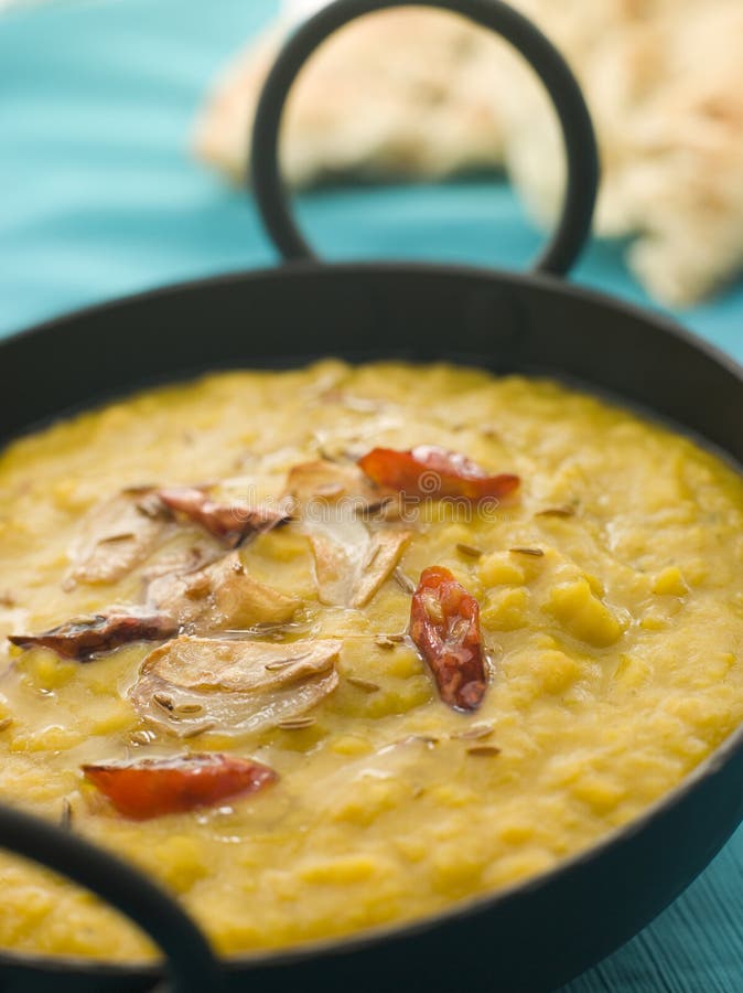 Karai Dish of Tarka Dhal with side of Naan Bread. Karai Dish of Tarka Dhal with side of Naan Bread