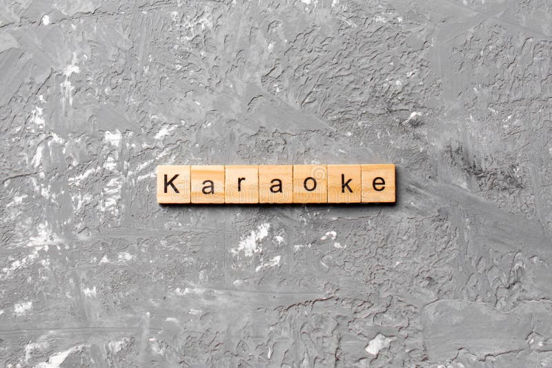Karaoke Written on Vintage Chalkboard with Microphone Stock Image