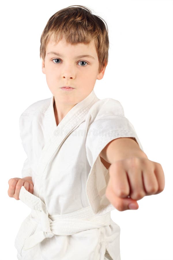 Karate boy in white kimono fighting isolated