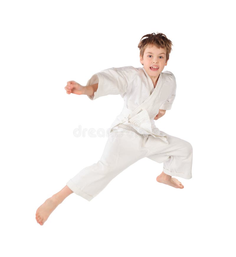 Karate boy in white kimono jumping isolated