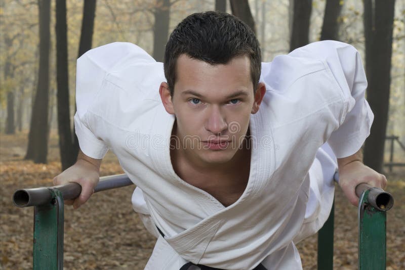 Karate training in autumn forest