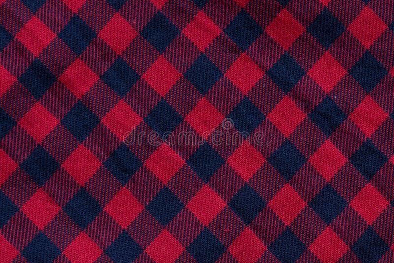 Checkered cloth texture with red and blue stripes, close-up. Checkered cloth texture with red and blue stripes, close-up