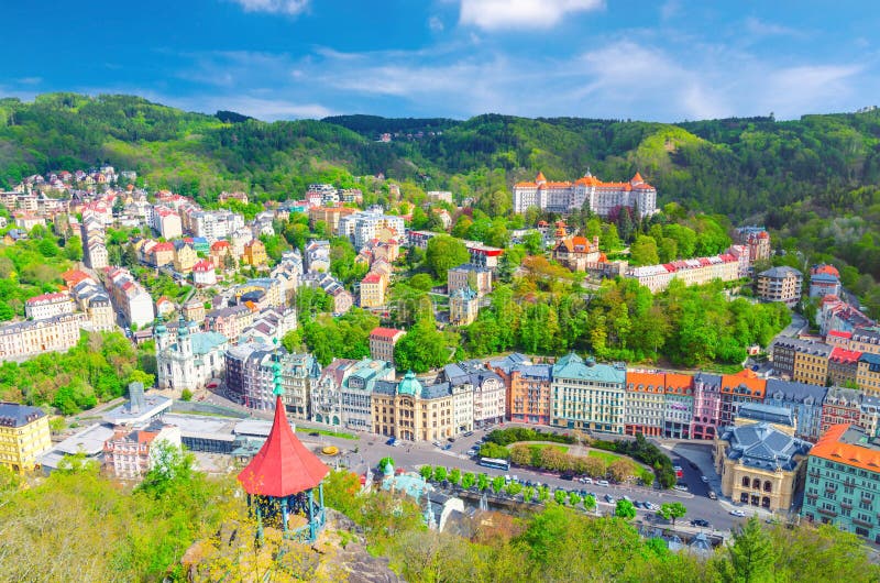Karlovy Vary Carlsbad historical city centre top aerial view with colorful beautiful buildings, Slavkov Forest hills