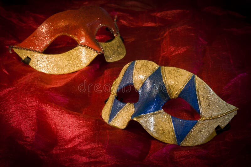 Two carnival masks on red background. Two carnival masks on red background