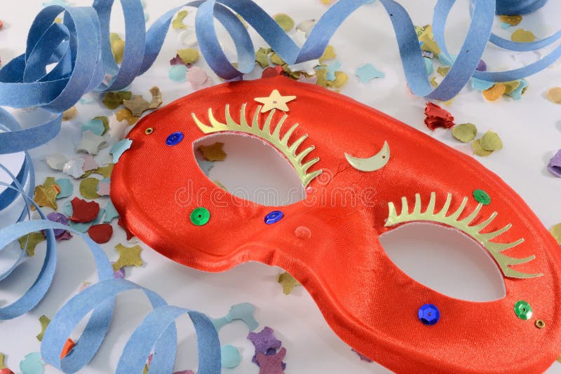 Red carnival mask, confetti and ribbon. Red carnival mask, confetti and ribbon.