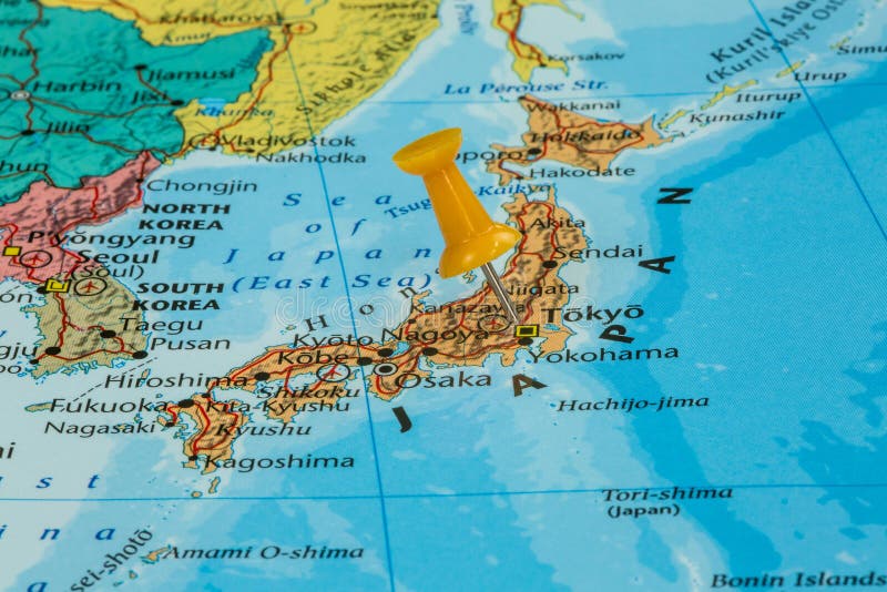 Map of Japan with a orange pushpin stuck. Map of Japan with a orange pushpin stuck