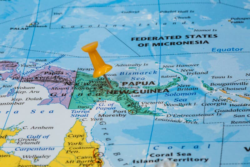 Map of Papua New Guinea with a orange pushpin stuck. Map of Papua New Guinea with a orange pushpin stuck