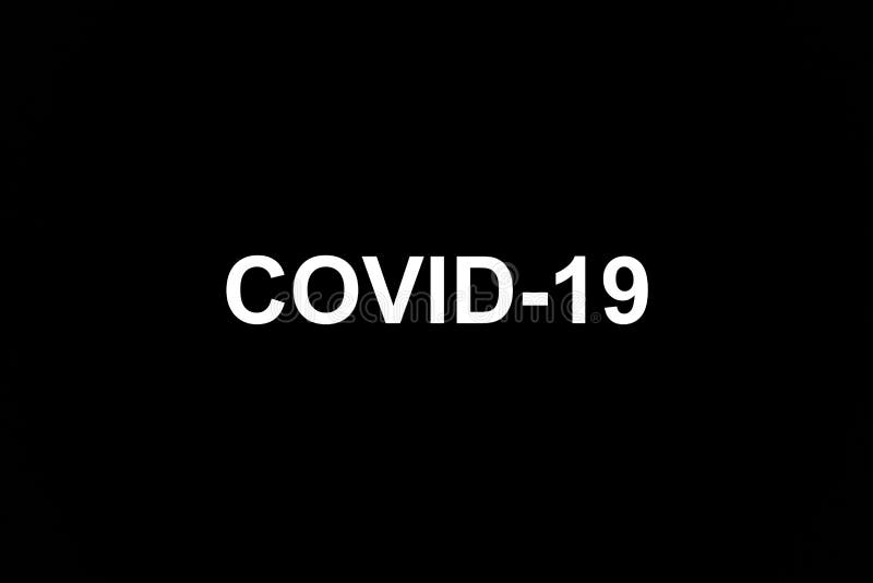 Inscription of Coronavirus Covid-19 made white on black. The most dangerous virus of the 21st century. Disease and infection. The invincible monster of world scale. Inscription of Coronavirus Covid-19 made white on black. The most dangerous virus of the 21st century. Disease and infection. The invincible monster of world scale