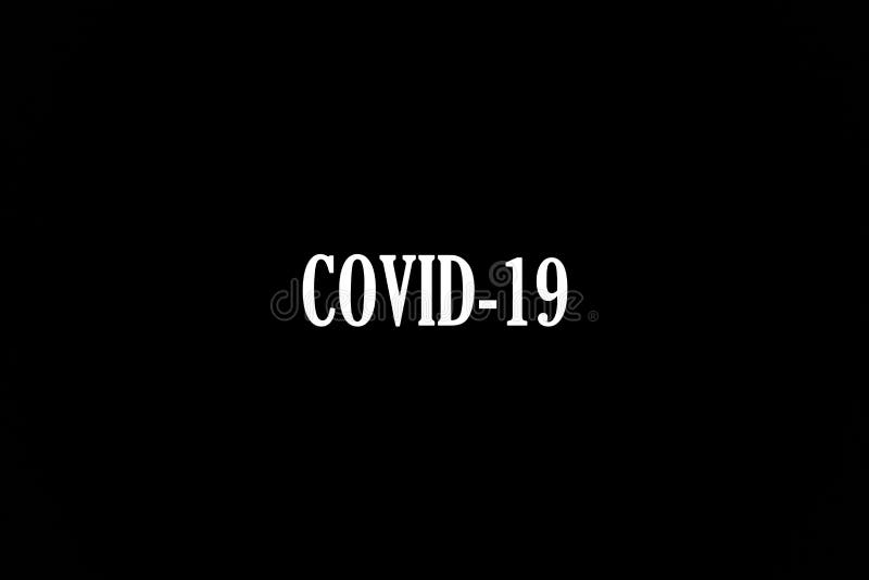 Inscription of Coronavirus Covid-19 made white on black. The most dangerous virus of the 21st century. Disease and infection. The invincible monster of world scale. Inscription of Coronavirus Covid-19 made white on black. The most dangerous virus of the 21st century. Disease and infection. The invincible monster of world scale