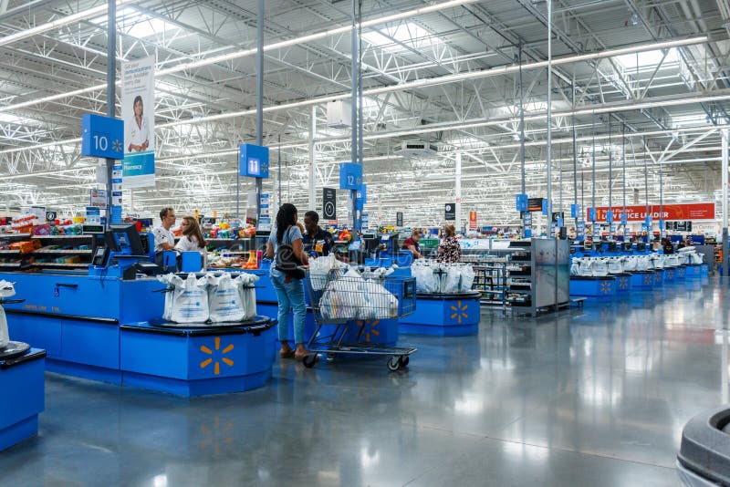 Miami/USA - April, 25 2019:Cashier counter in Walmart. Walmart Inc. is an American multinational retail corporation  operates a chain of hypermarkets, discount department stores, and grocery stores. Miami/USA - April, 25 2019:Cashier counter in Walmart. Walmart Inc. is an American multinational retail corporation  operates a chain of hypermarkets, discount department stores, and grocery stores