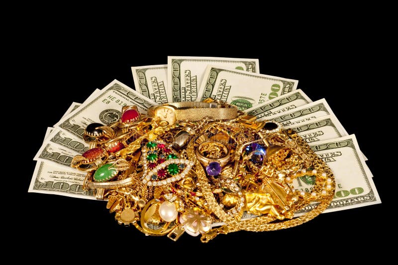 One hundred dollar bills and mound of gold jewelry on black background. One hundred dollar bills and mound of gold jewelry on black background.