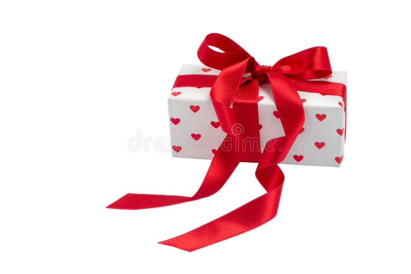 Kasten mit einem Geschenk mit dem Bild von den Herzen gebunden mit einem Bandisolat auf einem weißen Hintergrund Valentinsgruß ` lizenzfreies stockbild Kasten mit einem Geschenk mit dem Bild von den Herzen gebunden mit einem Bandisolat auf einem weißen Hintergrund Valentinsgruß ` lizenzfreies stockbild