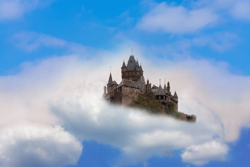 Photomontage of Reichsburg Cochem. Castle in the air Fantasy castle in the clouds. Photomontage of Reichsburg Cochem. Castle in the air Fantasy castle in the clouds