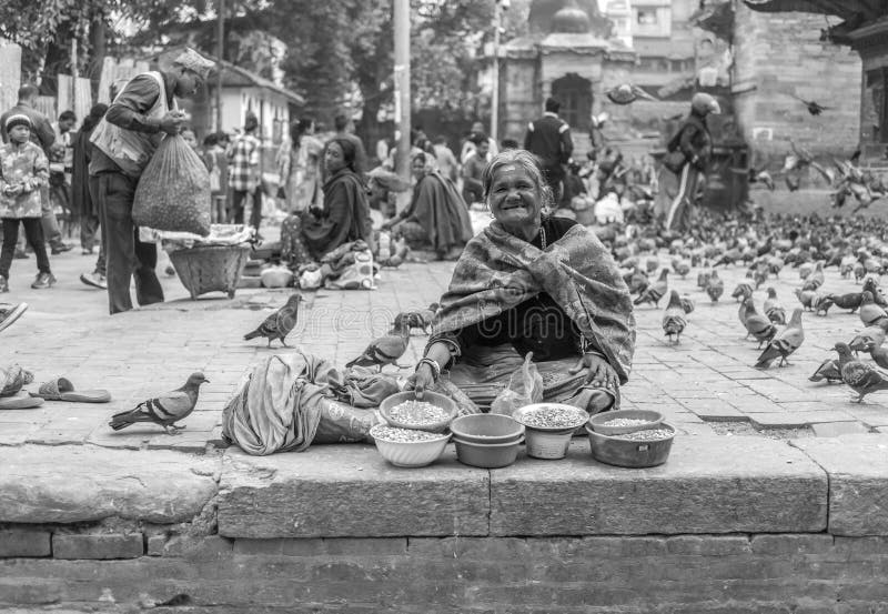 Nepalese woman sellinh seeds on street