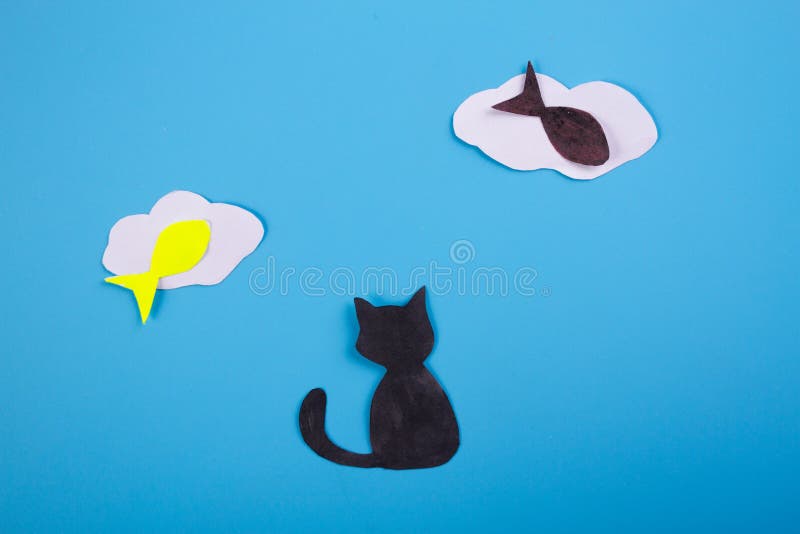 Katt och fisk arkivbild