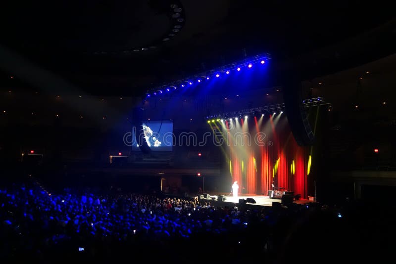 Katt Williams on stage in front of large crown on stage