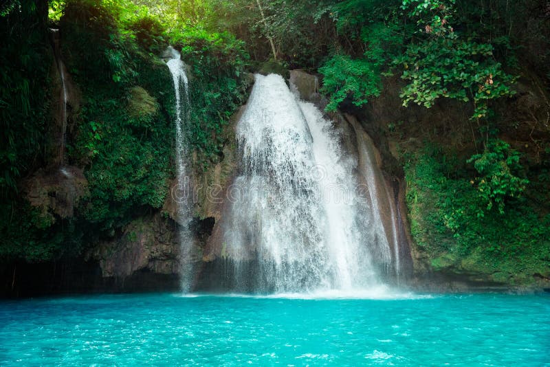 Kawasan waterfall in a mountain gorge in the tropical jungle of the Philippines, Cebu royalty free stock photo Kawasan waterfall in a mountain gorge in the tropical jungle of the Philippines, Cebu royalty free stock photo