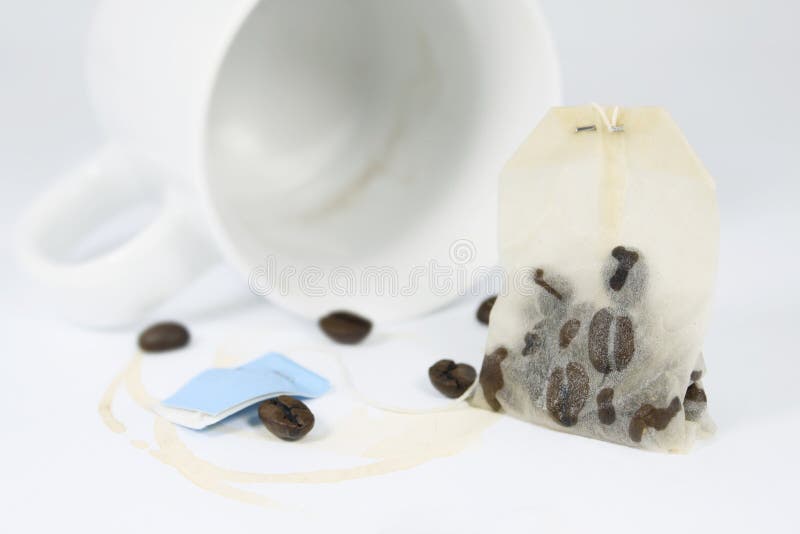 Coffeebeans in a teabag on white underground. Coffeebeans in a teabag on white underground