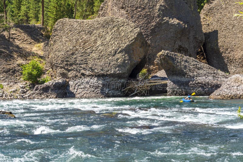 A kayaker paddles along the Spokane River at the Bowl and Pitcher area of Riverside State Park in Spokane, Washington, USA stock photos A kayaker paddles along the Spokane River at the Bowl and Pitcher area of Riverside State Park in Spokane, Washington, USA stock photos