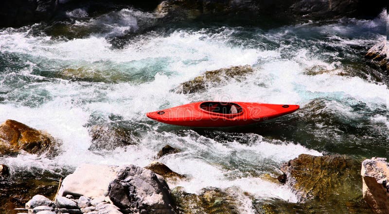 Kayaker in white water, rafting