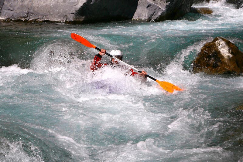 Kayaker in white water, rafting