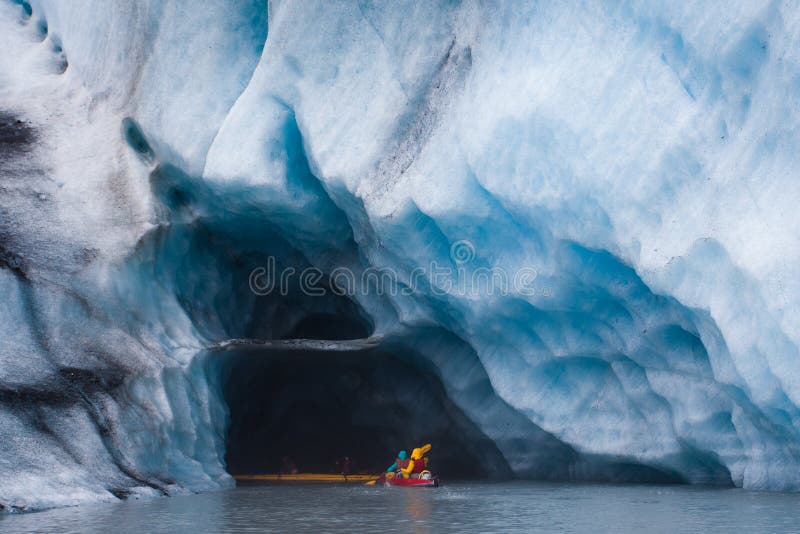 Kayaking into blue ice cave