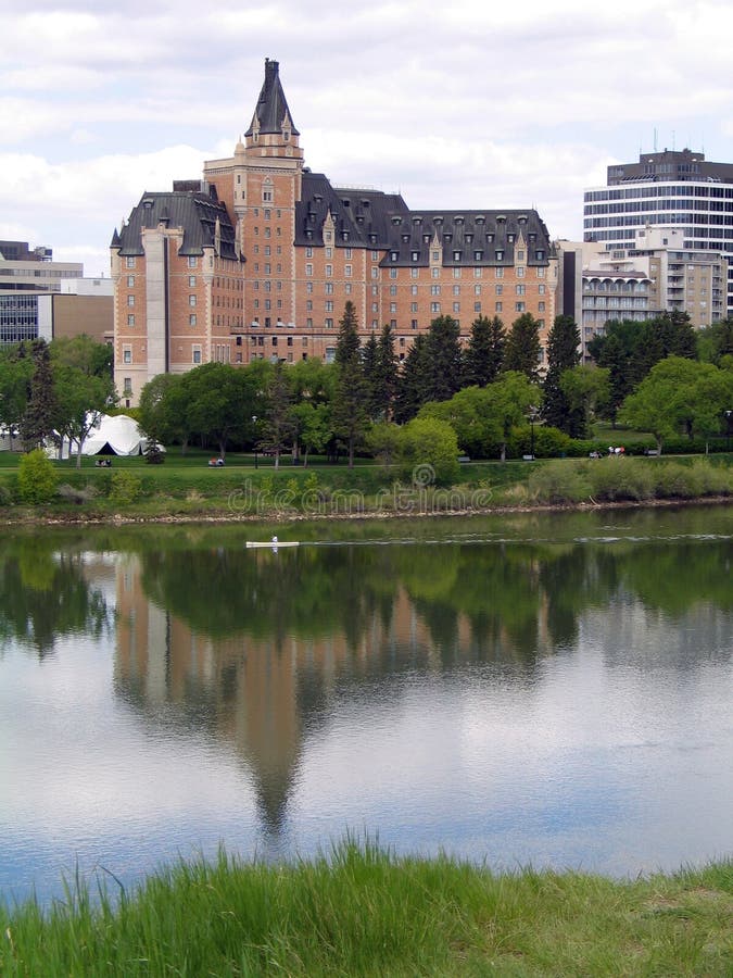 Kayaker in reflection of the Delta Bessborough Hotel on the South Saskatchewan River, Saskatoon, Saskatchewan. Kayaker in reflection of the Delta Bessborough Hotel on the South Saskatchewan River, Saskatoon, Saskatchewan