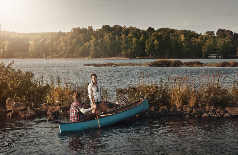 Kayaking for Two. a Young Couple Going for a Canoe Ride on the Lake
