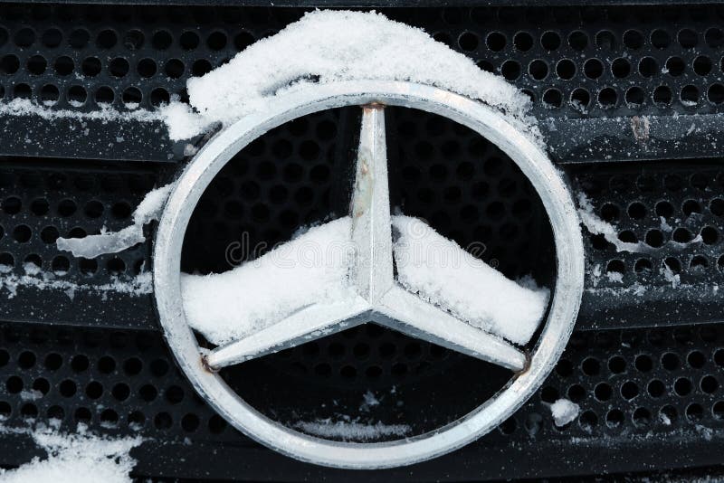 Kazakhstan, Kostanay, 2019-01-19. Mercedes iconic logotype covered with snow flakes. Winter. Close-up.Mercedes-Benz is automobile stock photography Kazakhstan, Kostanay, 2019-01-19. Mercedes iconic logotype covered with snow flakes. Winter. Close-up.Mercedes-Benz is automobile stock photography
