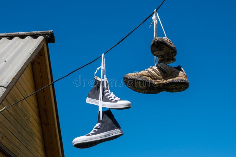 Sneakers Hanging on Electric Wires Editorial Stock Photo - Image of ...