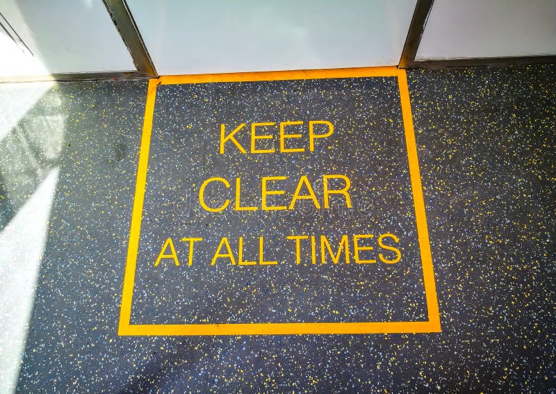 Keep clear at all times sign on the train floor.