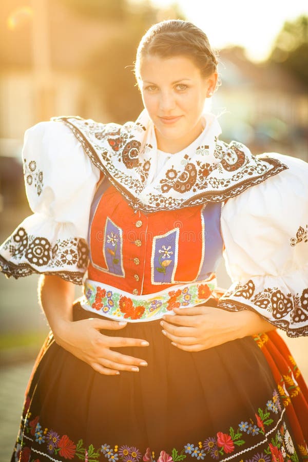young woman in a richly decorated ceremonial folk dress
