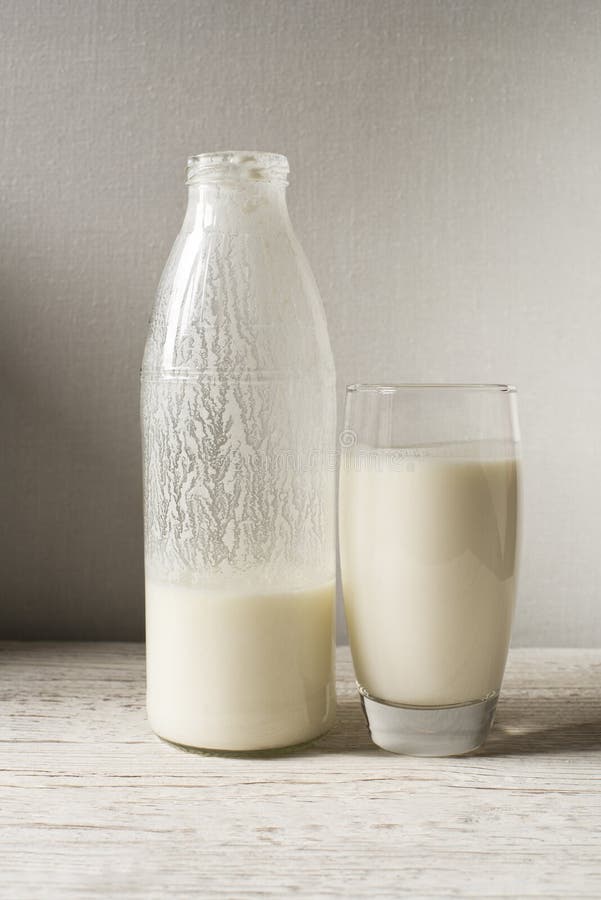 Milk kefir in a glass on wooden table