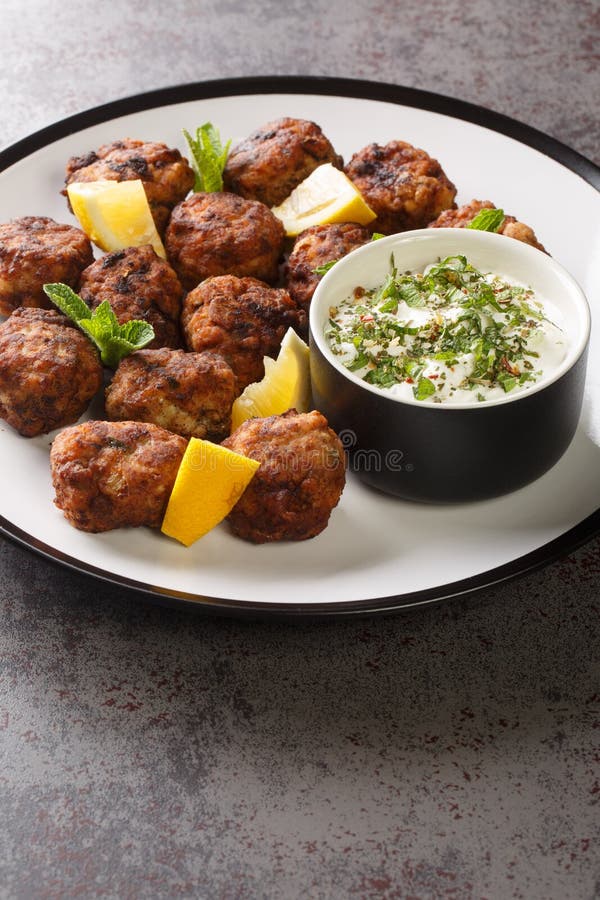 Keftedakia Fried Greek Meatballs with Tzatziki Sauce and Lemon on a ...