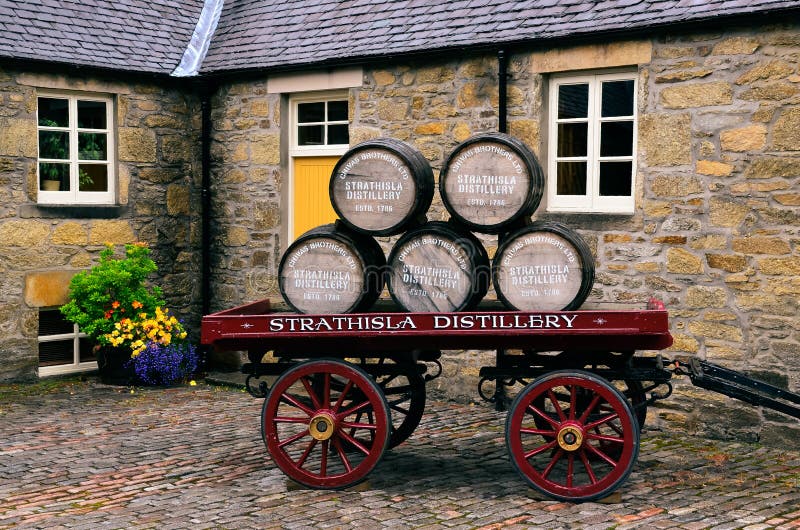 KEITH, UNITED KINGDOM - SEPTEMBER 6 2013: Wooden whisky barrels on an old cart in Strathisla distillery, Keith, United Kingdom