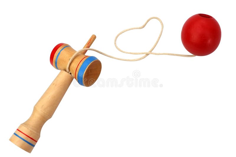 Kendama, традиционный японец забавляется состоять из шпаги и шарика соединенных строкой свернутой в форме сердца. Kendama, традиционный японец забавляется состоять из шпаги и шарика соединенных строкой свернутой в изолированной форме сердца, на белой предпосылке