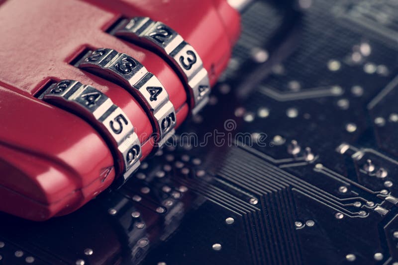 Code numbers on combination pad lock on computer circuit board with solder, digital cyber safety or security encryption concept, technology to encode online information or data protection. Code numbers on combination pad lock on computer circuit board with solder, digital cyber safety or security encryption concept, technology to encode online information or data protection.