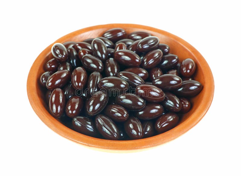 Keramischer Teller Moosbeerfrucht Softgels lizenzfreie stockbilder Keramischer Teller Moosbeerfrucht Softgels lizenzfreie stockbilder