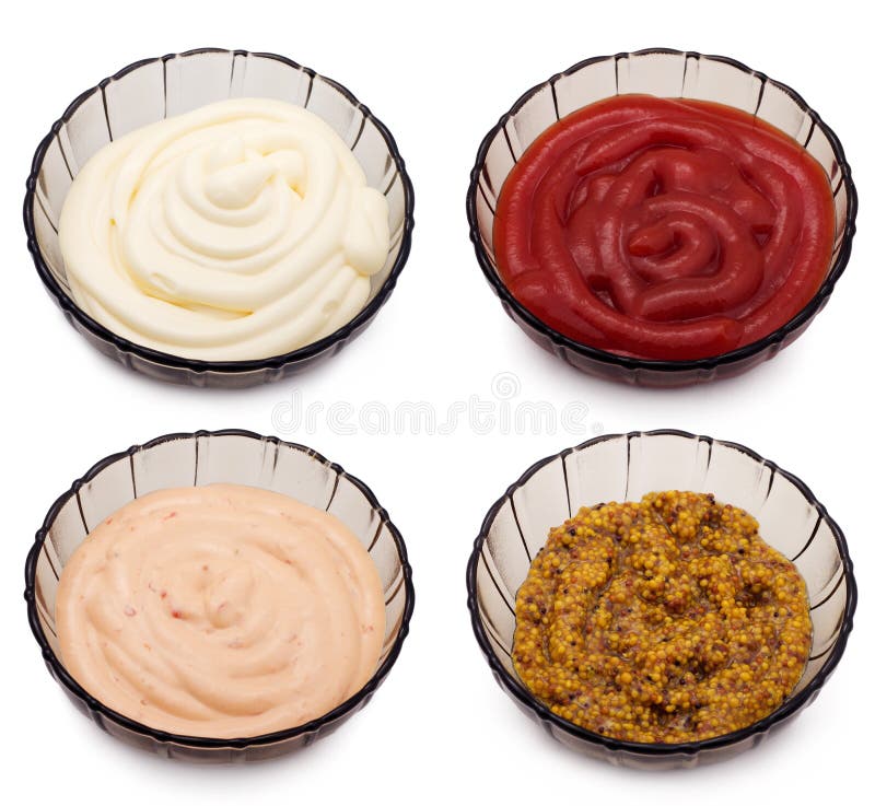 Ketchup, mayonnaise, french mustard and paprika sauce in bowls isolated. Ketchup, mayonnaise, french mustard and paprika sauce in bowls isolated