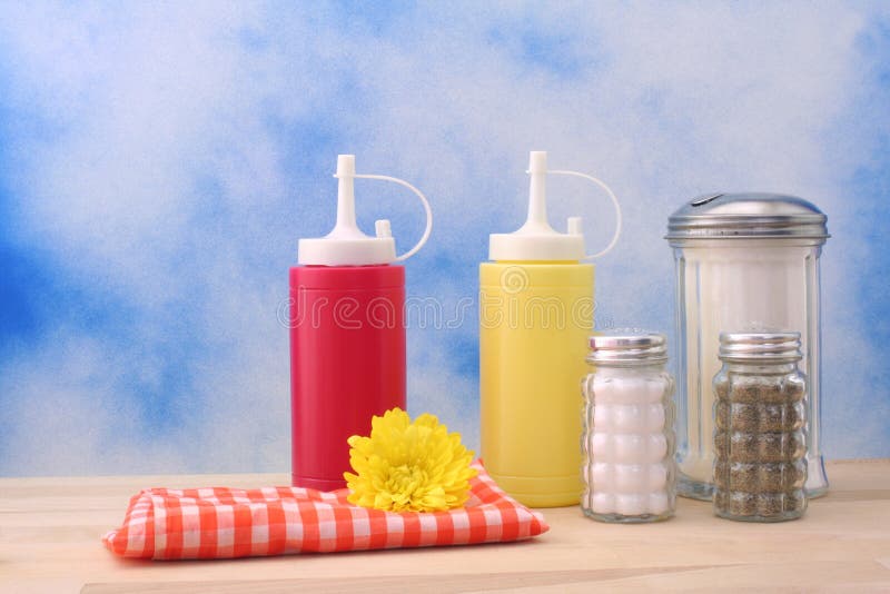 Ketchup, Mustard and Sugar on Blue Textured Background Diner or Kitchen