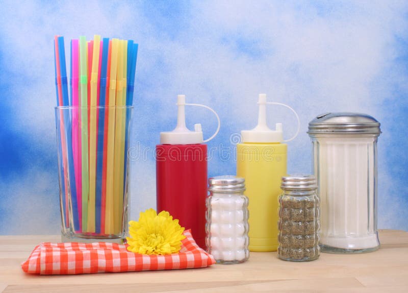 Ketchup, Mustard and Sugar on Blue Textured Background Diner or Kitchen