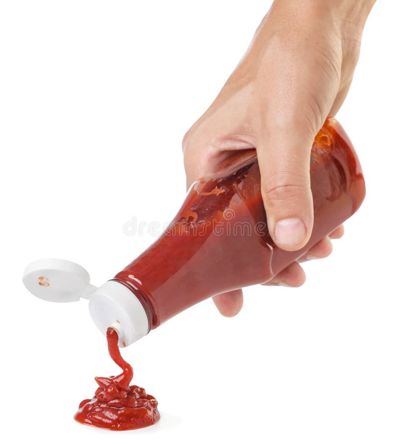 Ketchup Squeezes Out of a Bottle Hand on a White Background. Isolated
