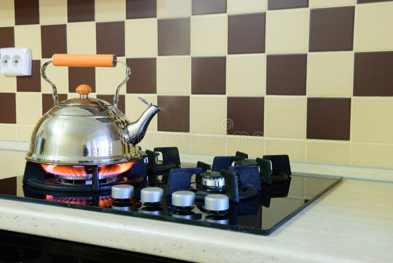 Kettle Basking in the Modern Gas Stove Stock Photo Image of table