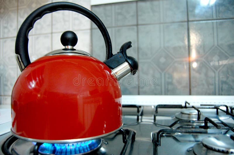 Kettle Boiling On A Gas Stove In The Kitchen. Focus On A Spout