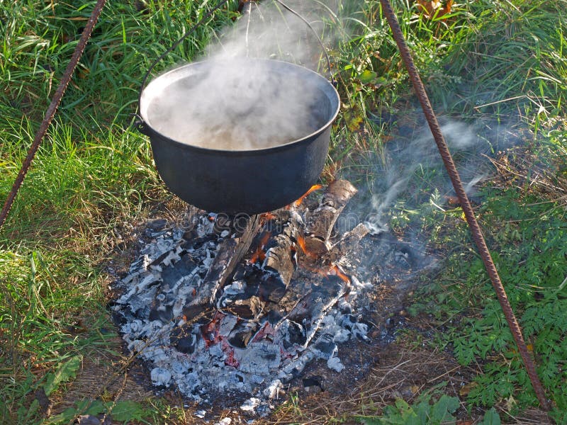 Kettle on campfire stock photo. Image of kettle, tripod 34694286