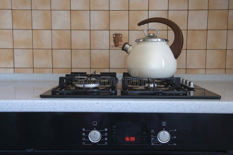 Kettle on the gas stove stock photo. Image of cooker 136236486